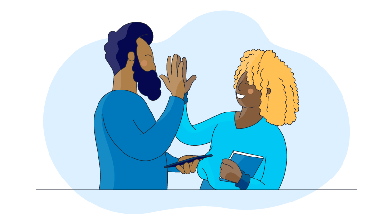 two people high fiving because they moved passed communication barriers at work 